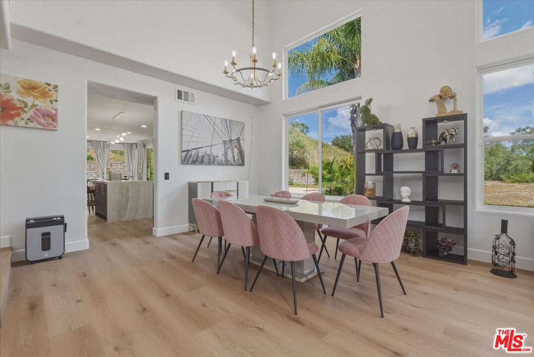 3891 Marks Road Agoura Hills, CA 91301 - Photo 11 of 52 a view of a dining room with furniture window and wooden floor