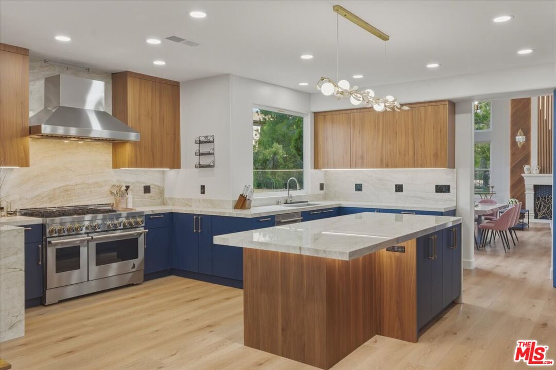 3891 Marks Road Agoura Hills, CA 91301 - Photo 13 of 52 a kitchen with stainless steel appliances granite countertop a stove a sink a refrigerator and a oven