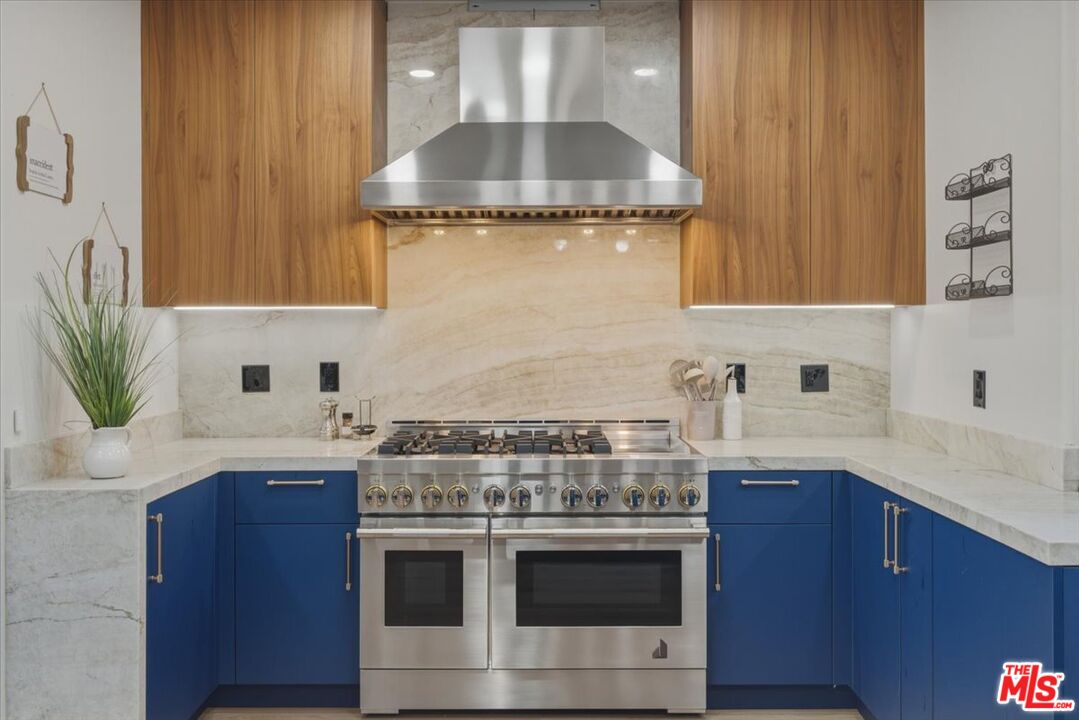 3891 Marks Road Agoura Hills, CA 91301 - Photo 14 of 52 a kitchen with stainless steel appliances granite countertop a sink stove and cabinets