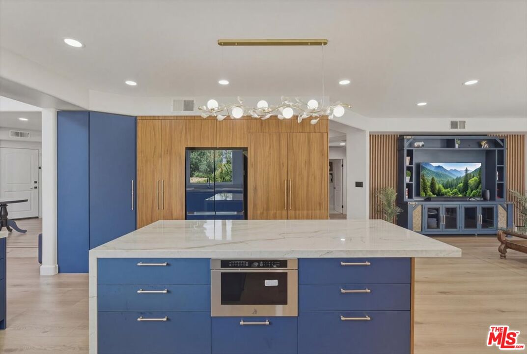 3891 Marks Road Agoura Hills, CA 91301 - Photo 15 of 52 a view of kitchen with kitchen island a sink stainless steel appliances and wooden floor