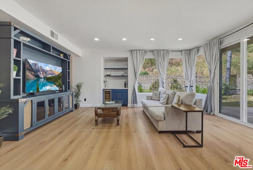 3891 Marks Road Agoura Hills, CA 91301 - Photo 19 of 52 a living room with furniture and a flat screen tv