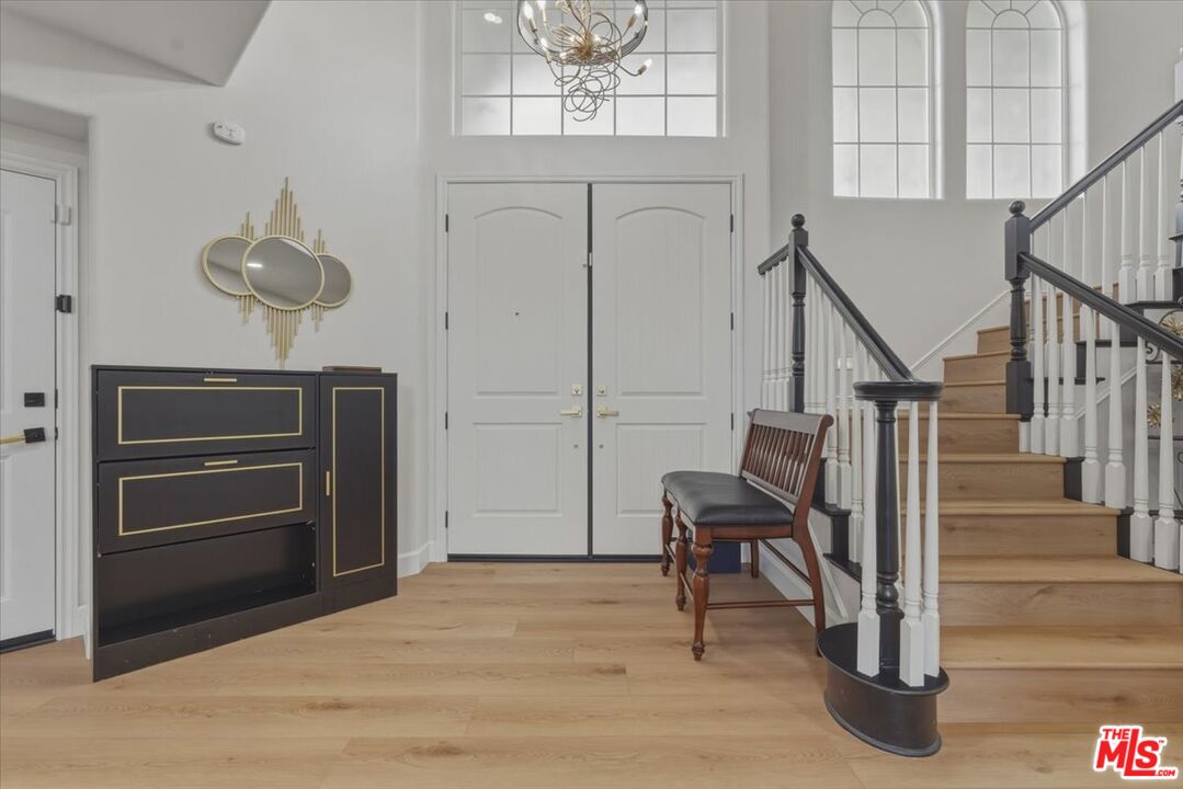 3891 Marks Road Agoura Hills, CA 91301 - Photo 23 of 52 a view of a hallway with entryway wooden floor and cabinet