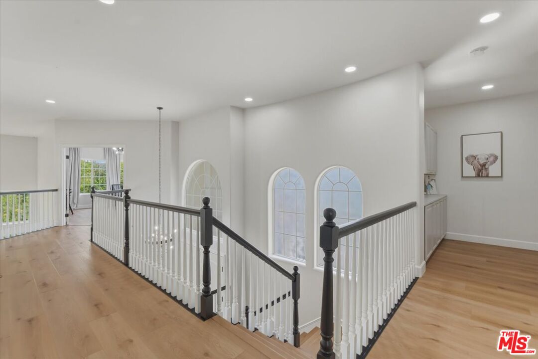 3891 Marks Road Agoura Hills, CA 91301 - Photo 27 of 52 a view of staircase with railing and white walls