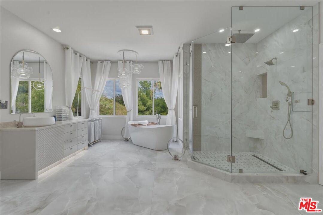 3891 Marks Road Agoura Hills, CA 91301 - Photo 32 of 52 a bathroom with a shower and a bathtub