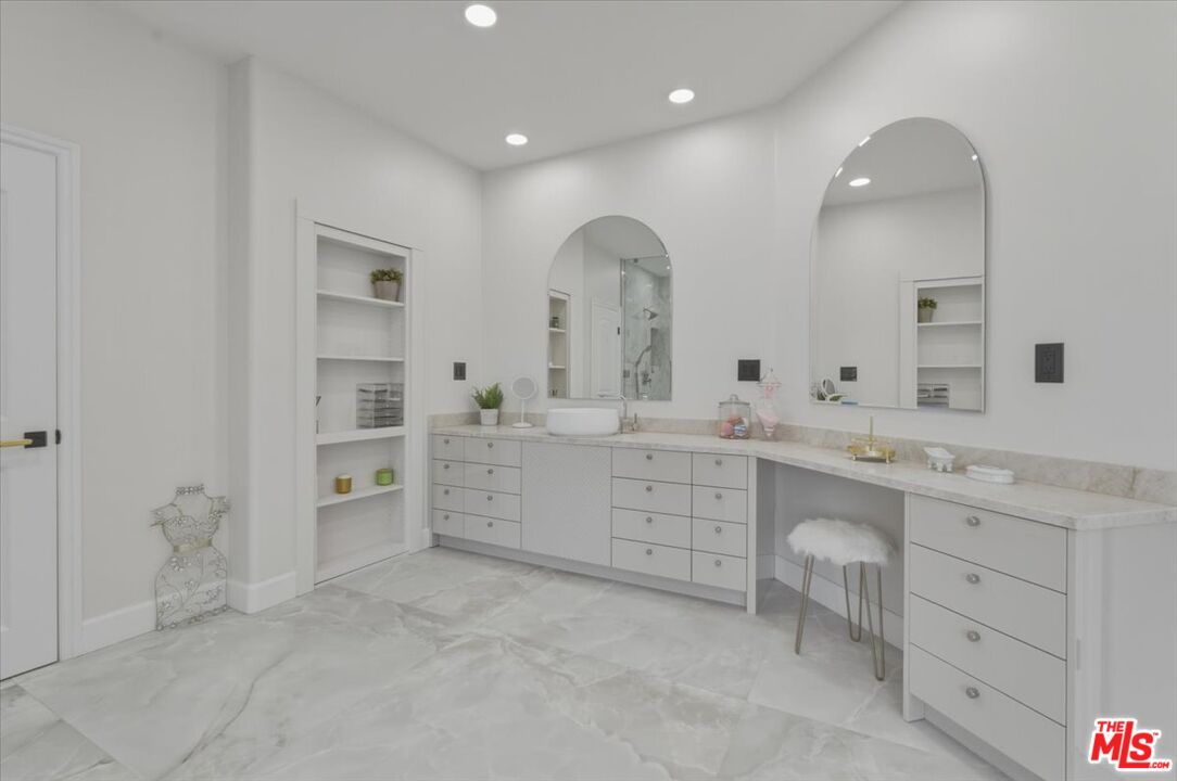 3891 Marks Road Agoura Hills, CA 91301 - Photo 35 of 52 a bathroom with a double vanity sink mirror and bathtub