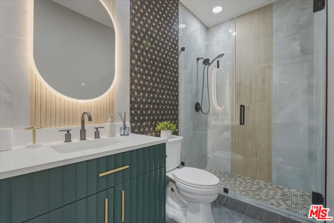 3891 Marks Road Agoura Hills, CA 91301 - Photo 38 of 52 a bathroom with a sink toilet and shower
