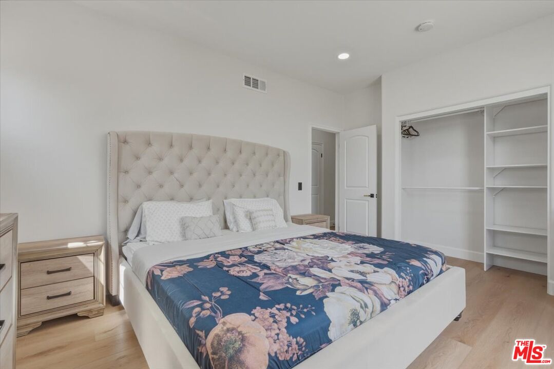 3891 Marks Road Agoura Hills, CA 91301 - Photo 39 of 52 a bedroom with a bed and walk in closet