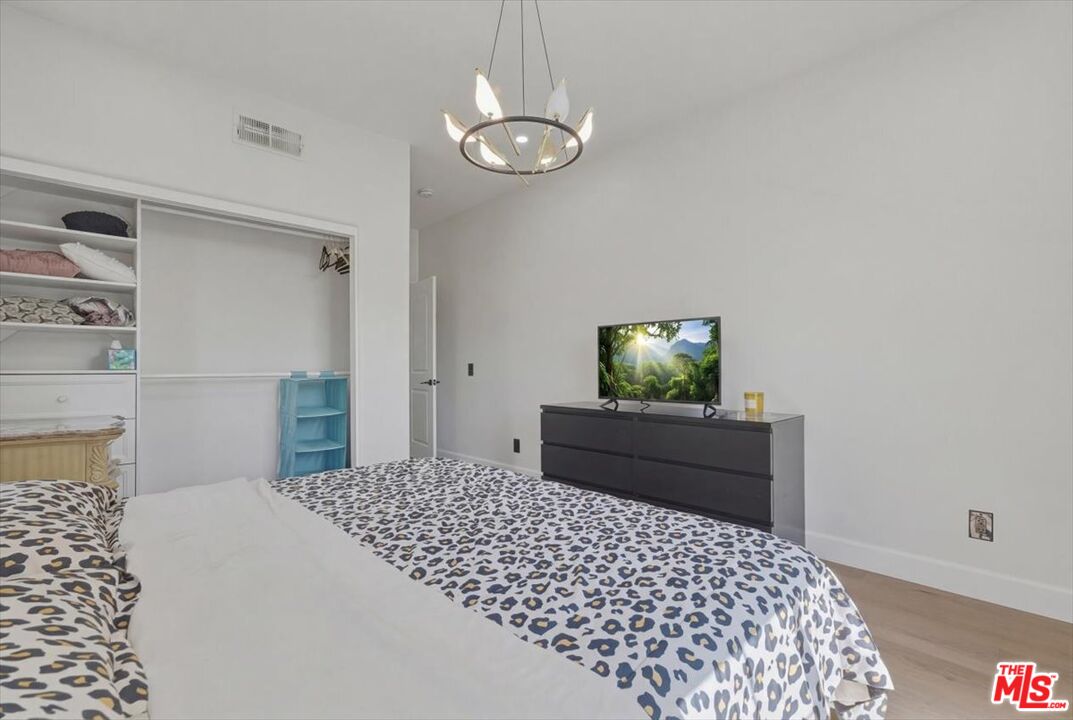3891 Marks Road Agoura Hills, CA 91301 - Photo 40 of 52 a bedroom with a bed and a cabinets