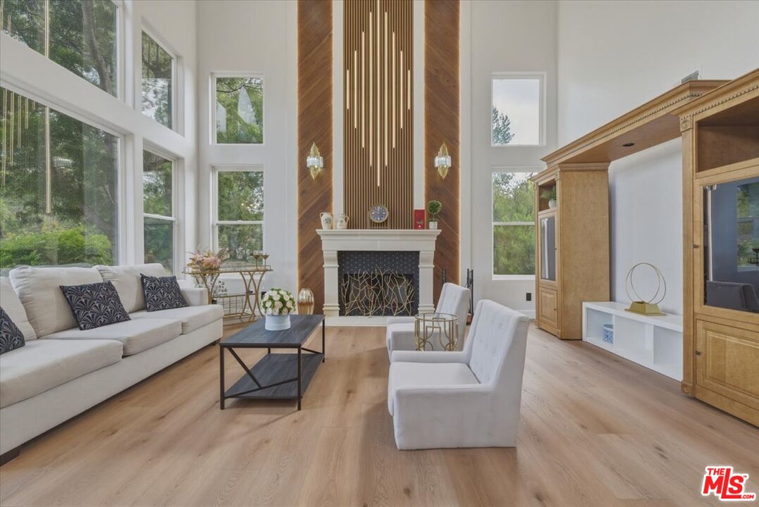 3891 Marks Road Agoura Hills, CA 91301 - Photo 4 of 52 a living room with furniture and a fireplace