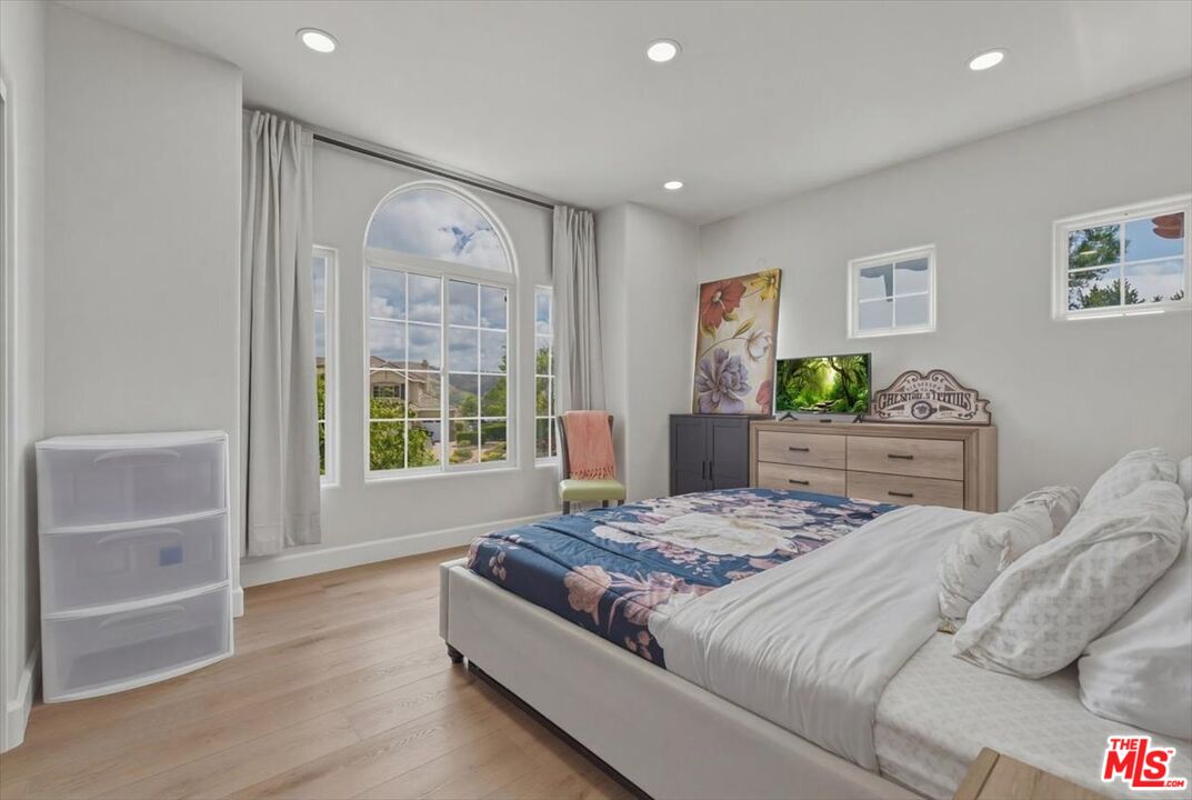 3891 Marks Road Agoura Hills, CA 91301 - Photo 41 of 52 a bedroom with a bed a dresser and next to a window