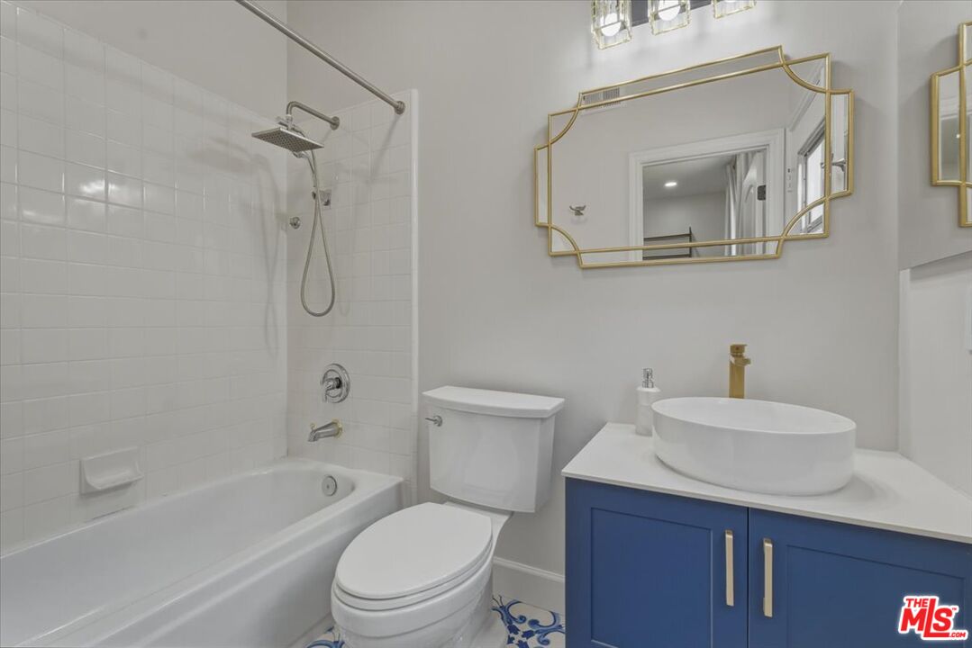 3891 Marks Road Agoura Hills, CA 91301 - Photo 47 of 52 a bathroom with a sink a toilet and shower
