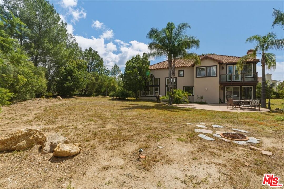 3891 Marks Road Agoura Hills, CA 91301 - Photo 51 of 52 a front view of a house with a yard