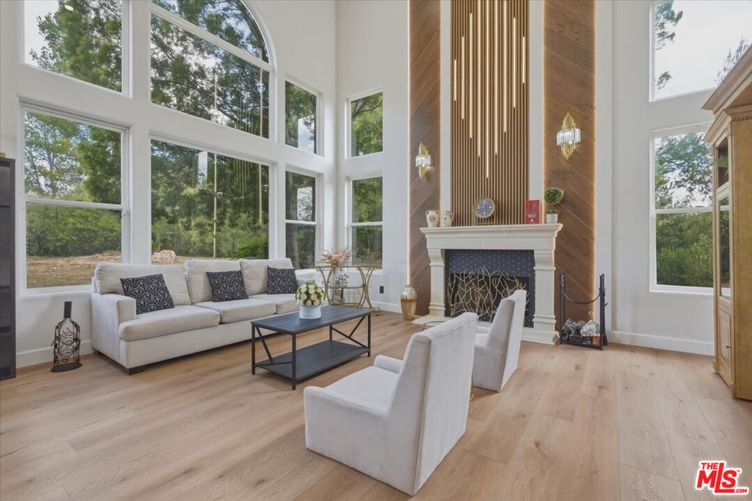 3891 Marks Road Agoura Hills, CA 91301 - Photo 6 of 52 a living room with furniture and a fireplace