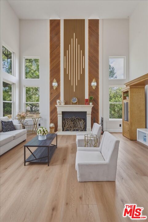3891 Marks Road Agoura Hills, CA 91301 - Photo 7 of 52 a living room with furniture and a fireplace