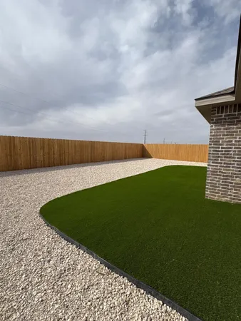 a view of yard with swimming pool and seating