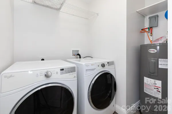 a view of livingroom with washer and dryer