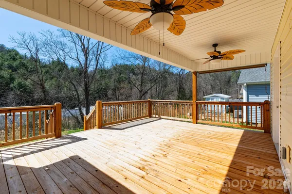 a view of a balcony with wooden floor