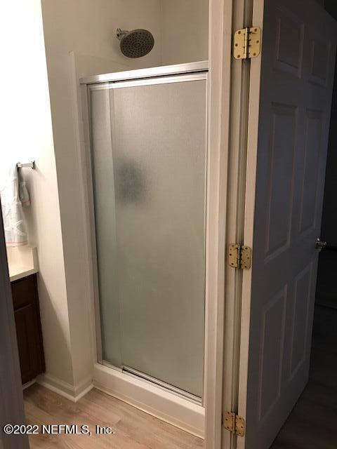 426 Dutton Island Road West Jacksonville, FL 32233 - Photo 12 of 22 a bathroom with a glass door shower