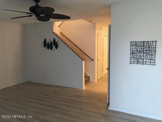 426 Dutton Island Road West Jacksonville, FL 32233 - Photo 13 of 22 a view of an empty room with wooden floor and windows