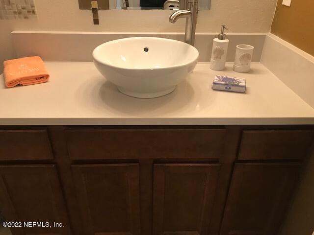 426 Dutton Island Road West Jacksonville, FL 32233 - Photo 16 of 22 a bathroom with a sink and a mirror