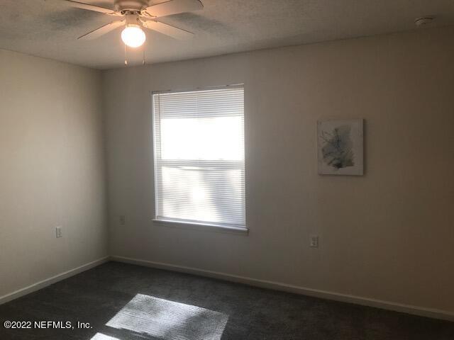 426 Dutton Island Road West Jacksonville, FL 32233 - Photo 19 of 22 an empty room with a window