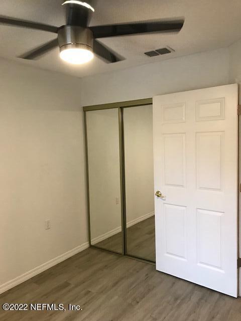 426 Dutton Island Road West Jacksonville, FL 32233 - Photo 20 of 22 an empty room with wooden floor