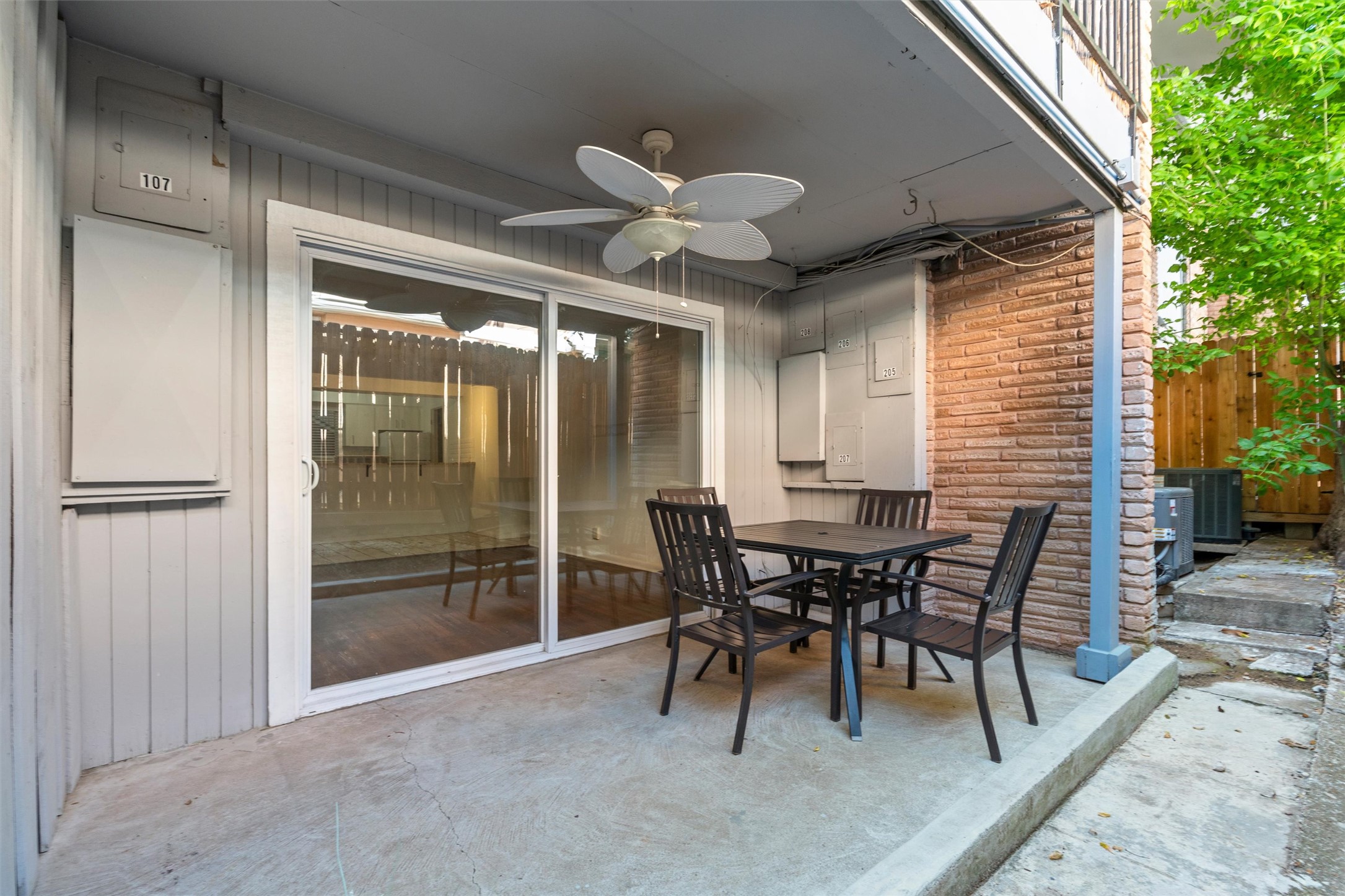 2208 Enfield Road, Unit 10500 Austin, TX 78703 - Photo 25 of 34 Covered outdoor patio with a concrete surface, featuring a ceiling fan and direct access to interior spaces via sliding glass doors