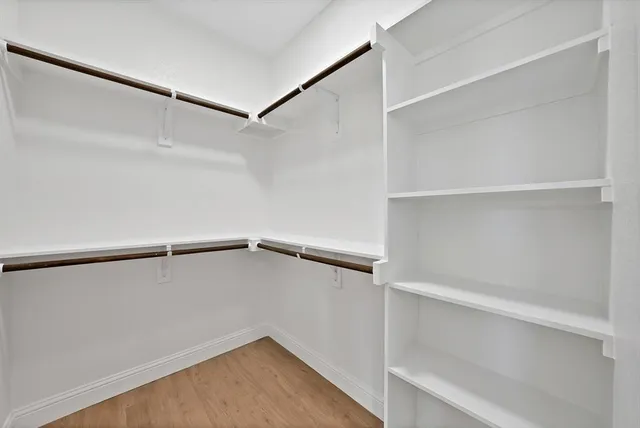 a view of an empty walk in closet