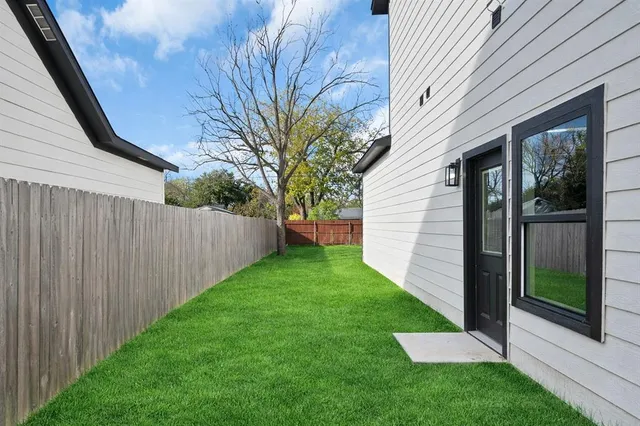 a view of a back yard from a balcony