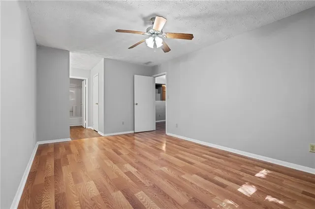 a view of a room with a ceiling fan