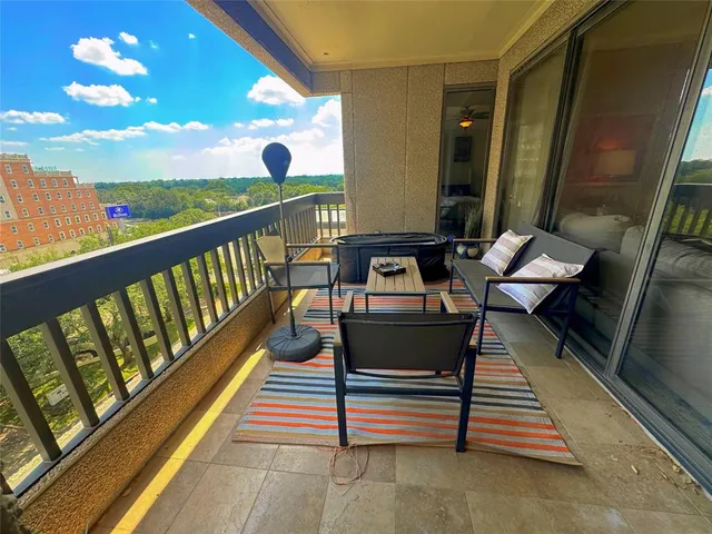 a balcony with wooden benches