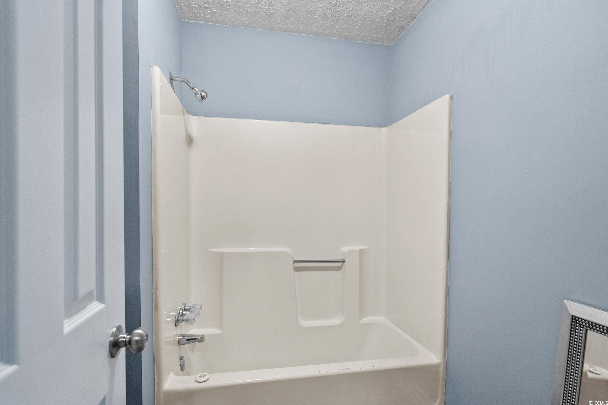 450 Highway 348 Loris, SC 29569 - Photo 25 of 37 Bathroom featuring shower / bath combination and a textured ceiling