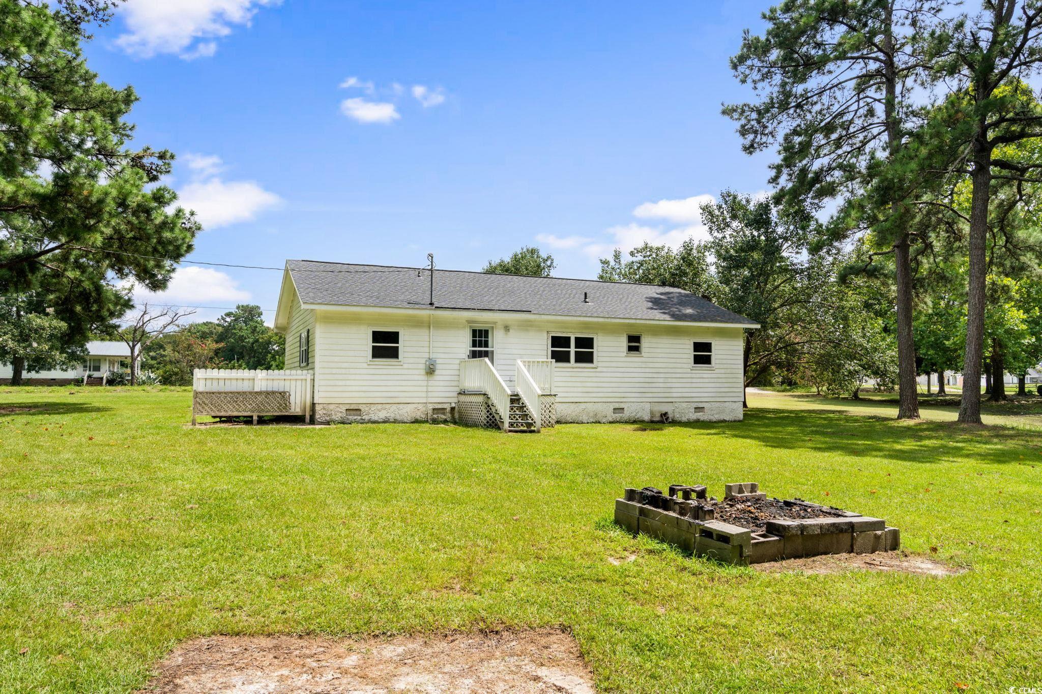 450 Highway 348 Loris, SC 29569 - Photo 31 of 37 Rear view of property with crawl space, a yard, roof with shingles, and a deck