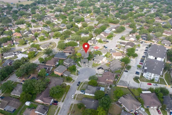 an aerial view of house with yard