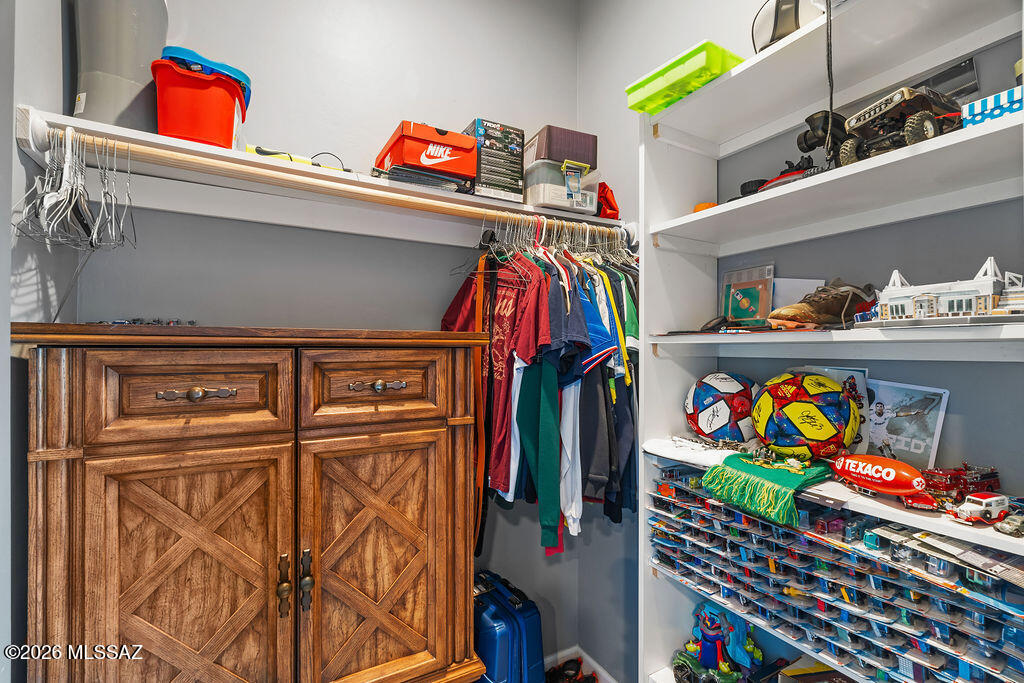 16276 East Empire View Road Vail, AZ 85641 - Photo 27 of 51 a store room with lots of different colored cloths