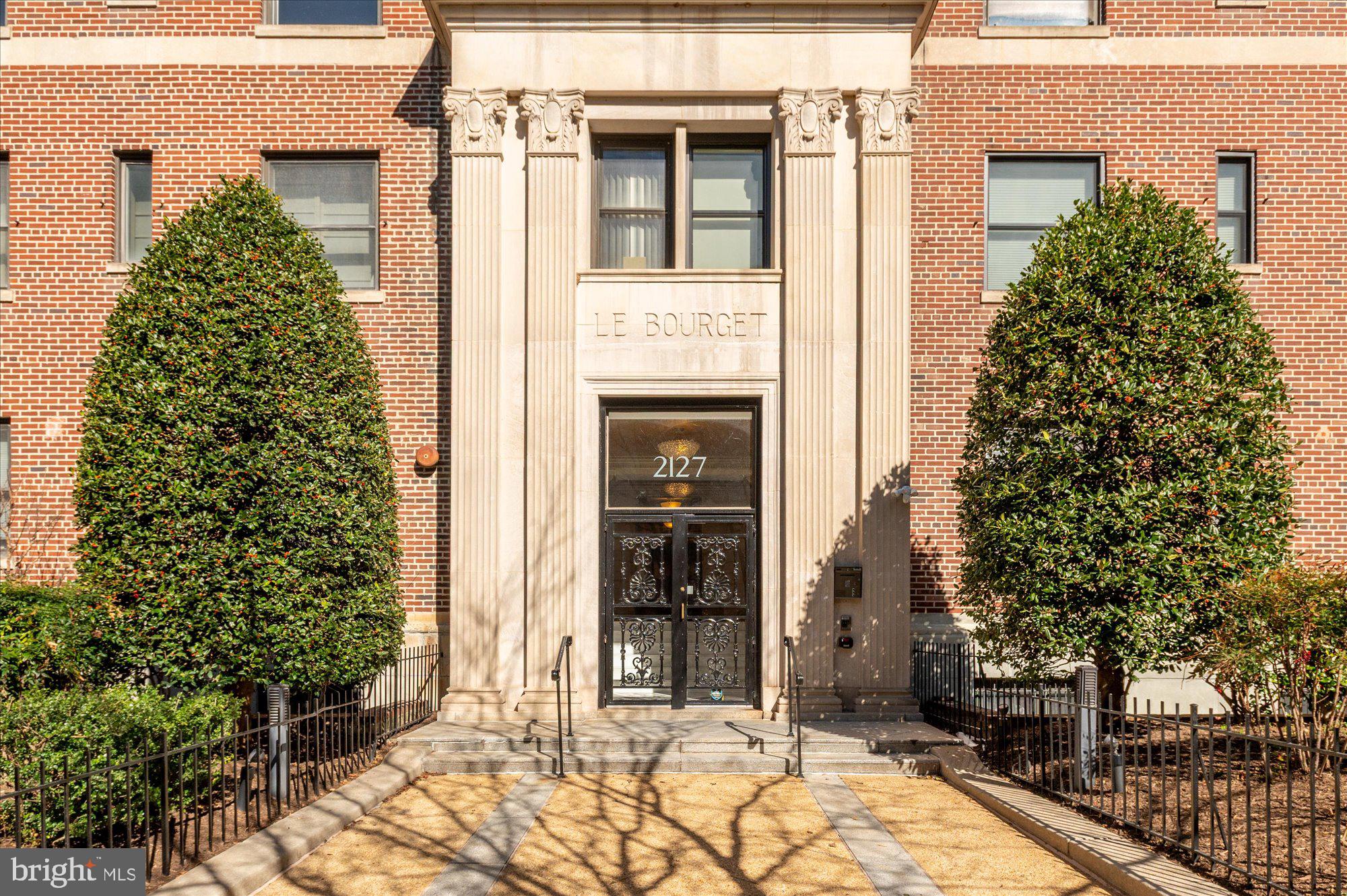 2127 California Street Northwest, Unit 803 Washington, DC 20008 - Photo 1 of 22 a front view of a house with a yard