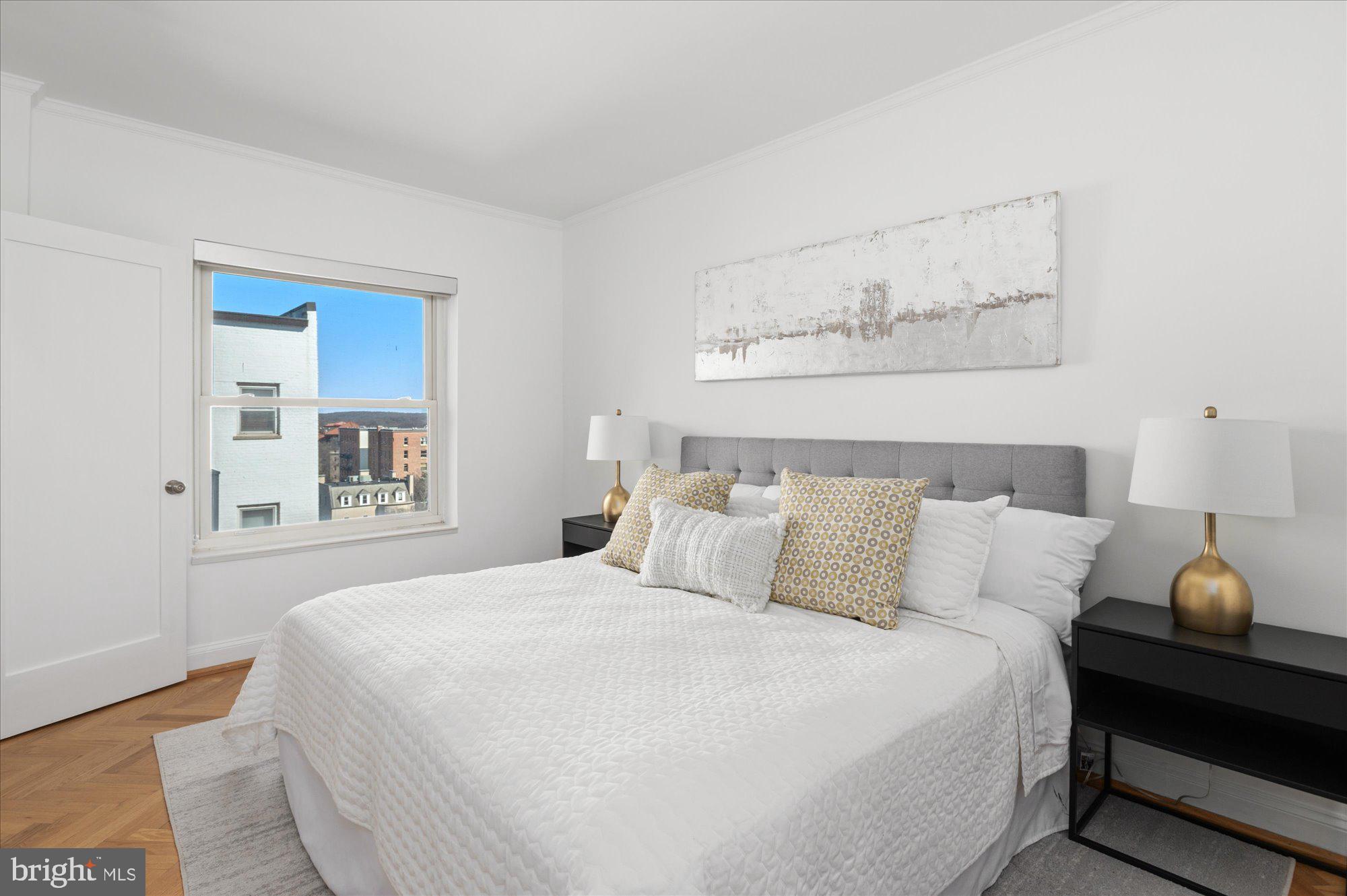 2127 California Street Northwest, Unit 803 Washington, DC 20008 - Photo 16 of 22 a bedroom with a bed and window