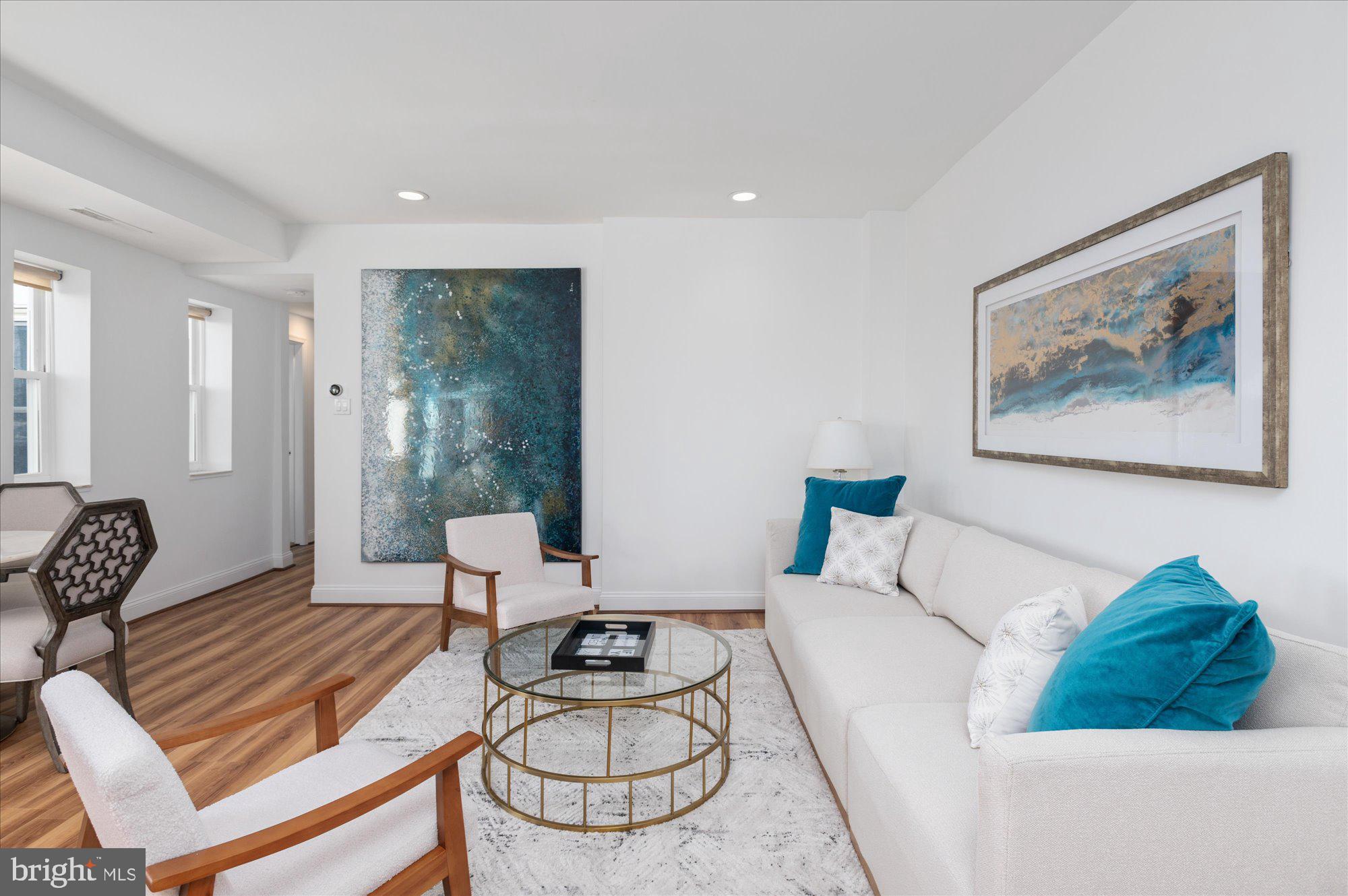 2127 California Street Northwest, Unit 803 Washington, DC 20008 - Photo 6 of 22 a living room with furniture and a wooden floor
