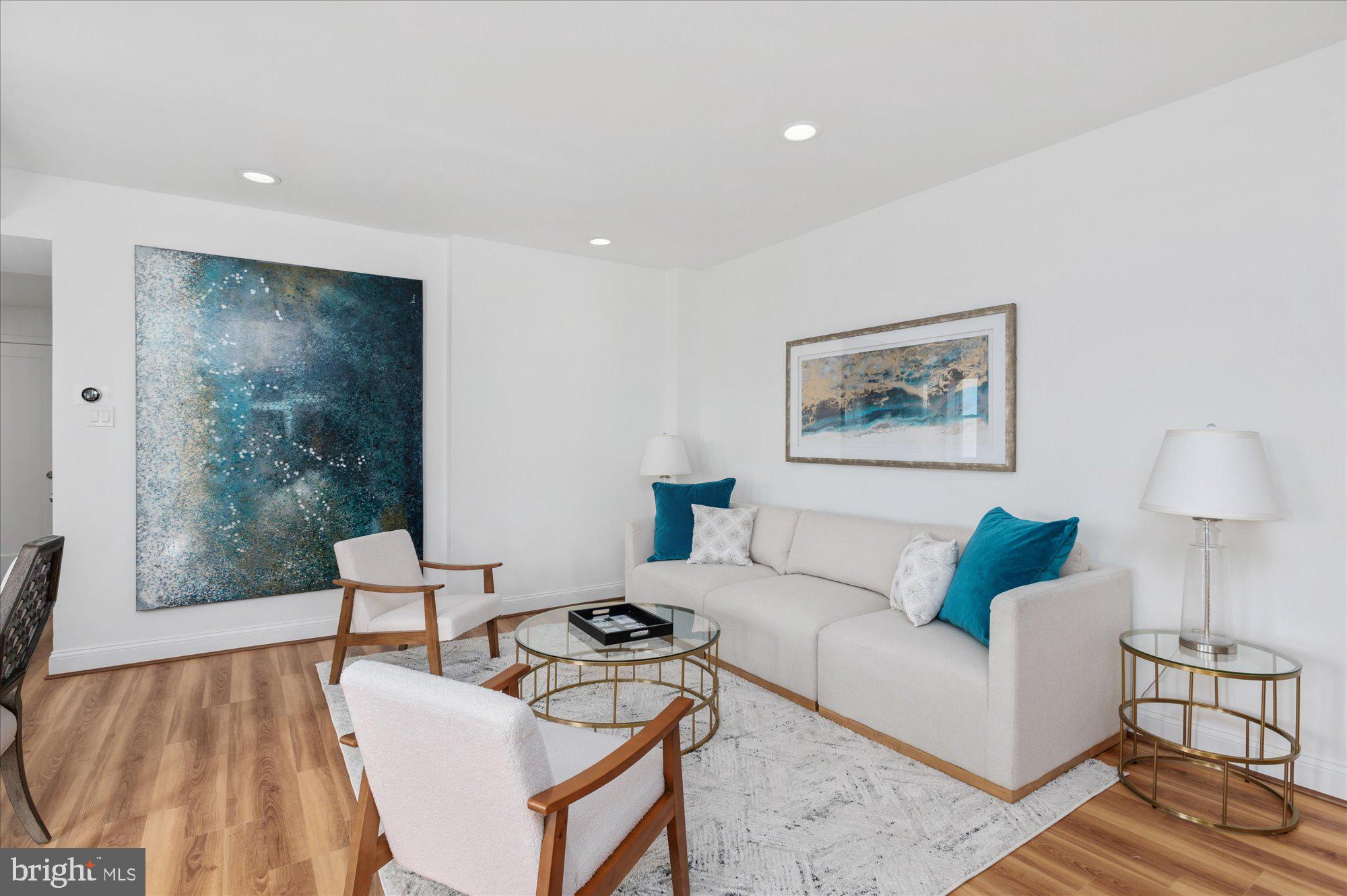 2127 California Street Northwest, Unit 803 Washington, DC 20008 - Photo 7 of 22 a living room with furniture and a window