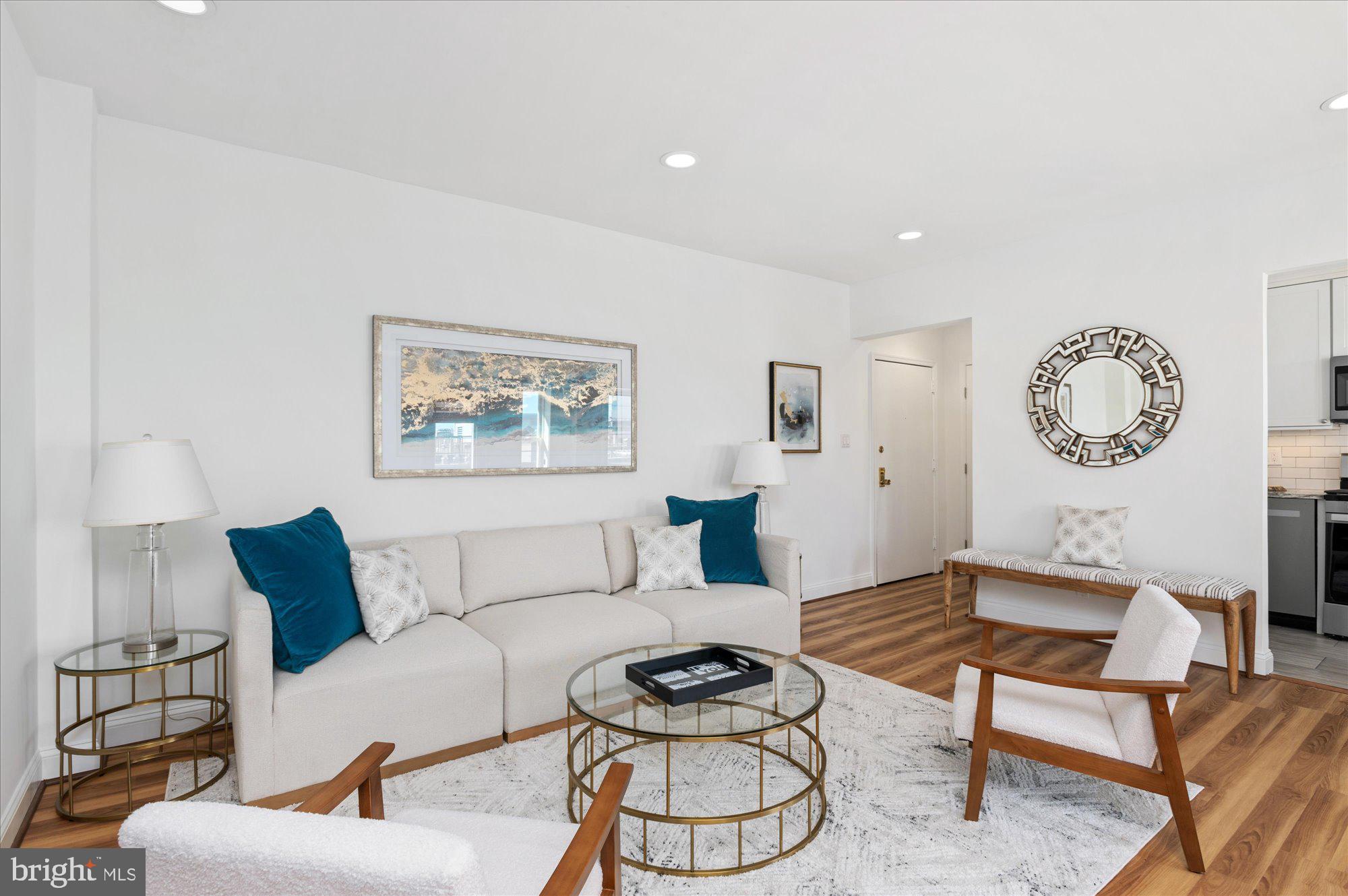 2127 California Street Northwest, Unit 803 Washington, DC 20008 - Photo 8 of 22 a living room with furniture and a wooden floor