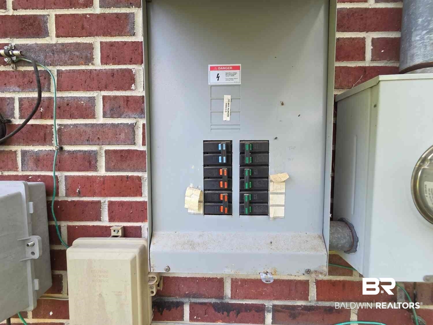 106 West 16th Street Bay Minette, AL 36507 - Photo 2 of 19 Utility room featuring electric panel and electric meter