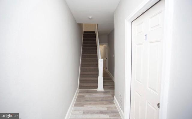 a view of a hallway with stairs