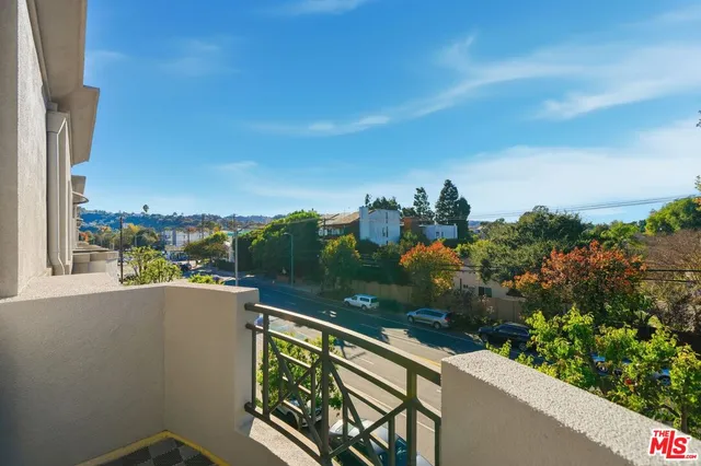 a view of a balcony with city view