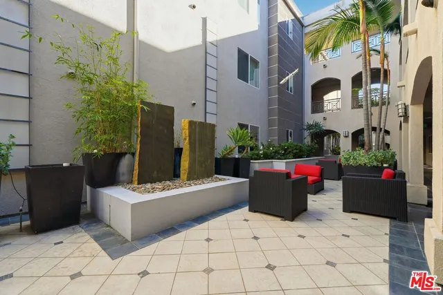 a view of a building with potted plants