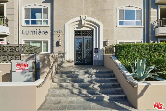 a front view of a building with glass windows