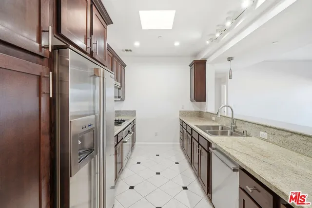 a bathroom with double vanity and a granite counter tops