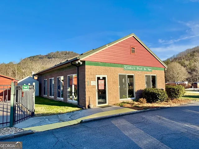 a view of a house with swimming pool and porch