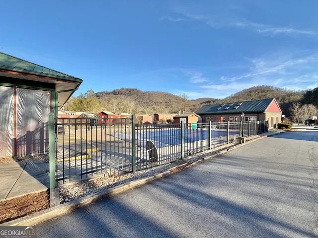 a view of houses with a street
