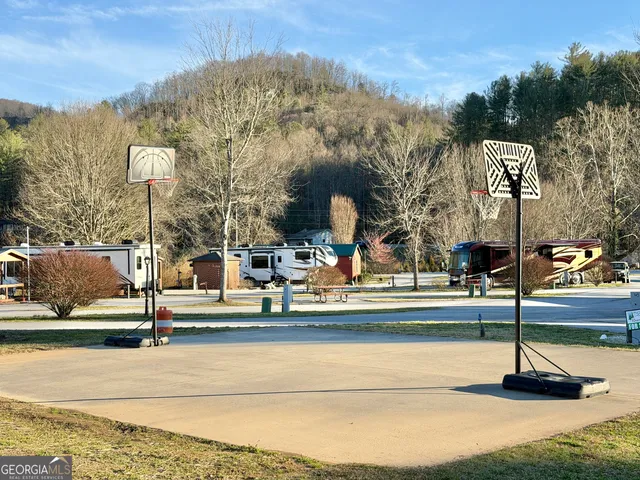 a view of a building with mountains in the background