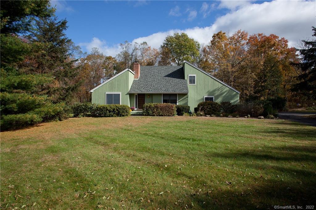 2 Smokey Ridge Road Simsbury, CT 06070 - Photo 1 of 1 a front view of house with a garden